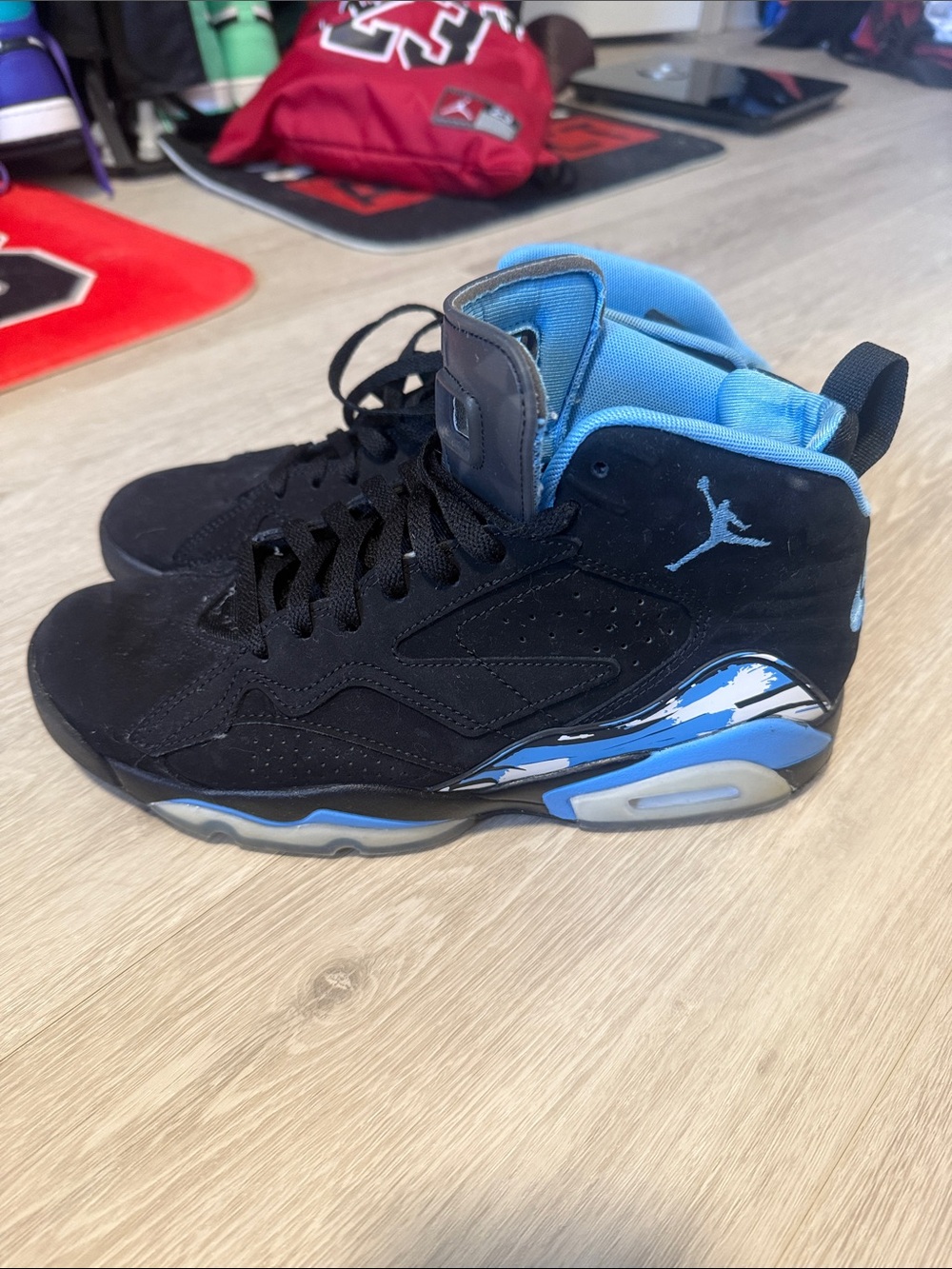 Jordan Retro High Top Sneakers in Black and University Blue